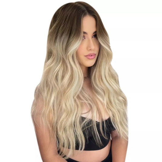 Model wearing long wavy balayage human hair butterfly weft extensions