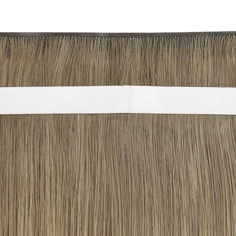 Load image into Gallery viewer, Close-up view of blonde highlight tape-in weft hair extensions.