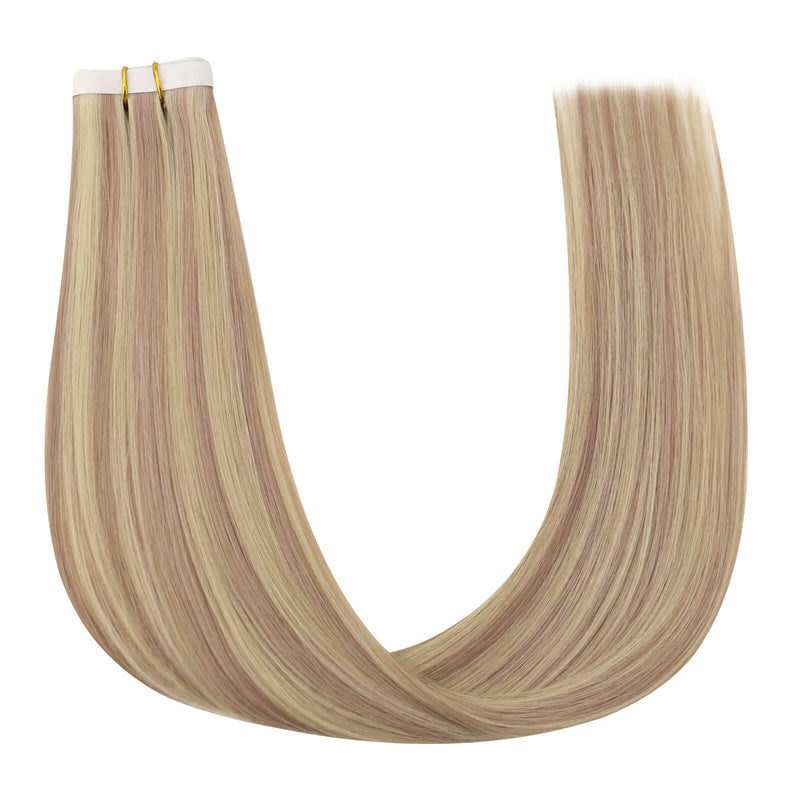 Load image into Gallery viewer, One bundle of straight invisible tape-in weft hair extensions featuring pink blonde highlights, secured with white bands and gold elastic ties, displayed on a white background.