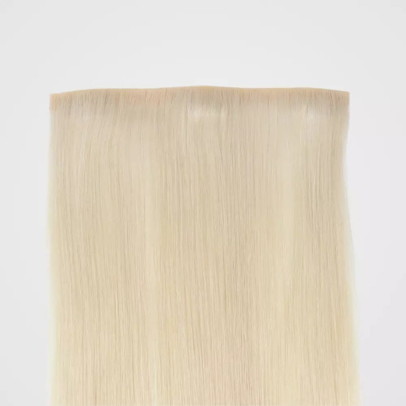 Load image into Gallery viewer, Blonde clip in hair extensions on a white background