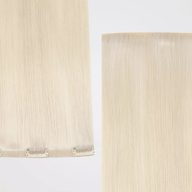 Load image into Gallery viewer, Two strands of blonde clip in hair extensions on a light background
