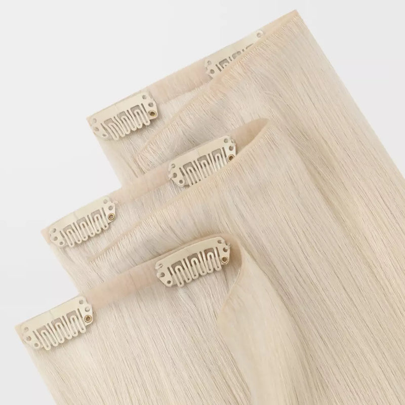 Load image into Gallery viewer, Set of blonde PU clip hair extensions on a white background