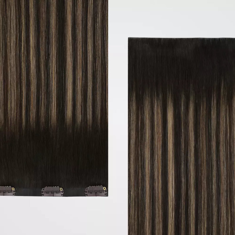 Load image into Gallery viewer, Close-up of clip hair extensions with a focus on texture and color gradient.
