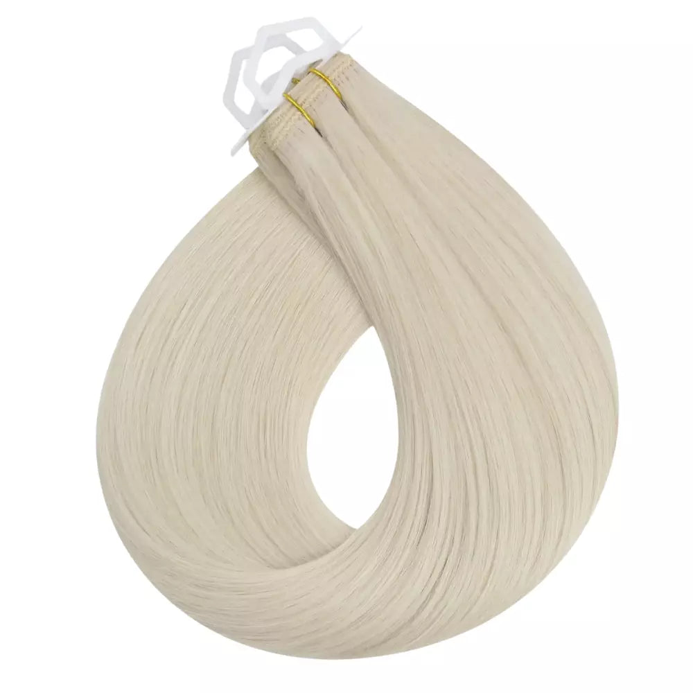 Blonde Remy virgin human hair machine weft, soft and natural extensions for sew-in hairstyles.