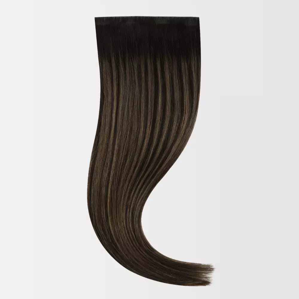 Brown clip hair extension on a white background