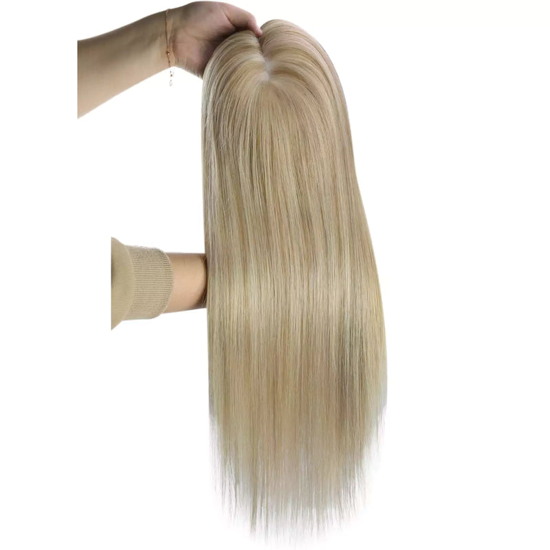 Load image into Gallery viewer, A long hair topper with a blonde highlights color, held up by a hand against a plain white background.

