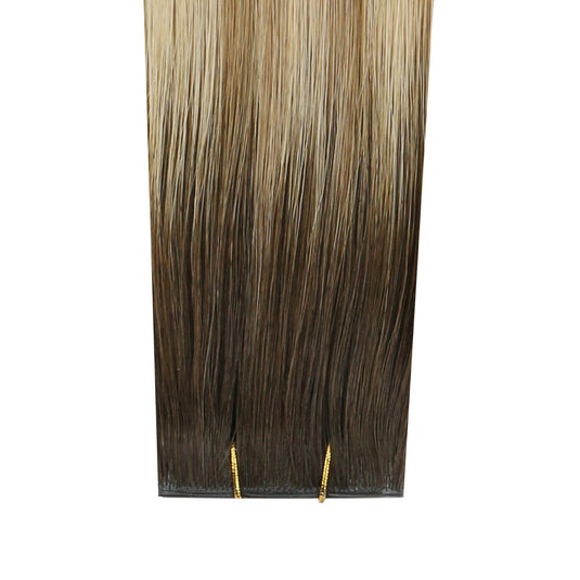 Brown and blonde hair extensions on a white background