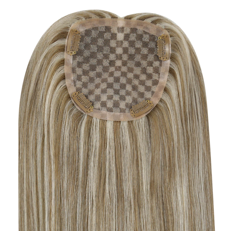 Load image into Gallery viewer, A close-up of a hairpiece extension with straight, shoulder-length blonde hair and a brown checkered adhesive inner cap on a white background.

