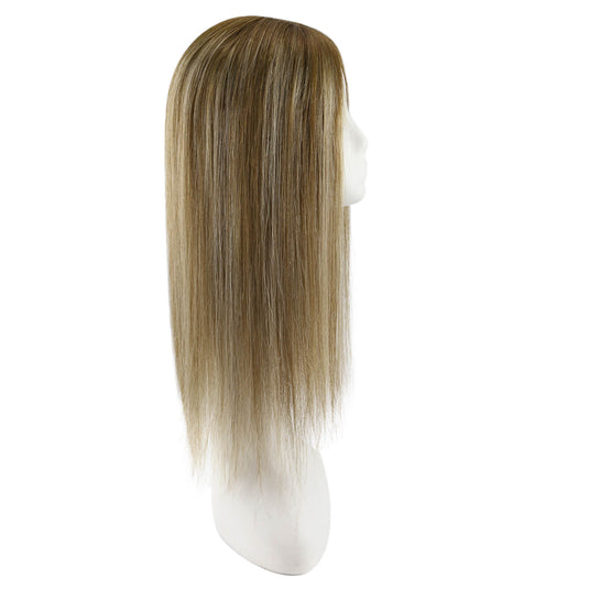 A straight, shoulder-length topper with a balayage brown color, displayed on a white mannequin head against a plain white background.