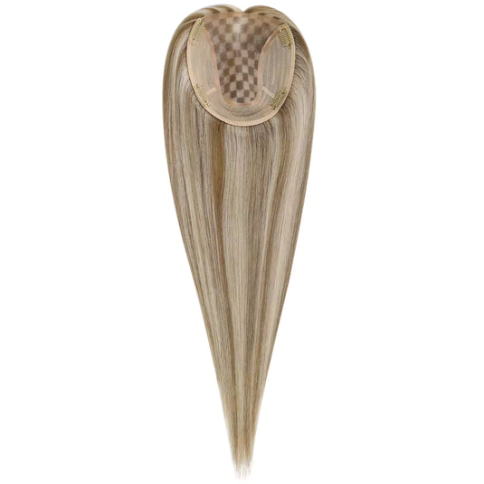 A heart-shaped hairpiece extension with long, straight blonde hair and a beige mesh crown, shown against a plain white background.