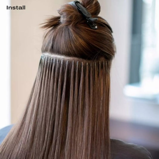 Close-up of applying Human Hair I-Tip extensions with microbeads, showing heat-free, gentle installation for seamless, natural-looking hair