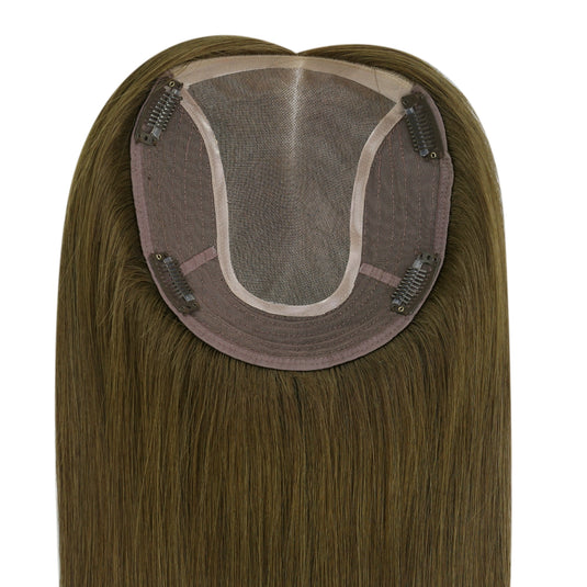 Brown hair topper on a white background