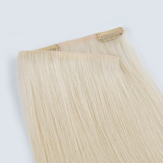Blonde hair extensions on a white background