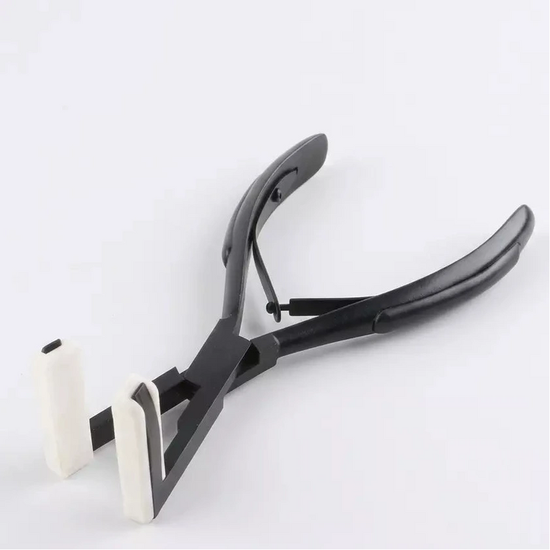 Load image into Gallery viewer, Black pliers with white handles on a light gray background

