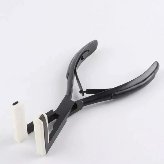 Black pliers with white handles on a light gray background