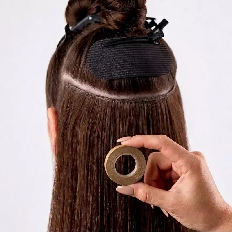 Load image into Gallery viewer, Person with a hair extension being held by a hand against a white background

