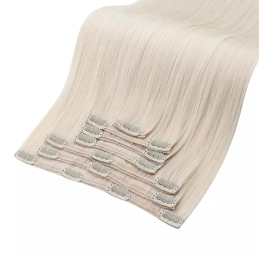 Set of blonde hair extensions on a white background