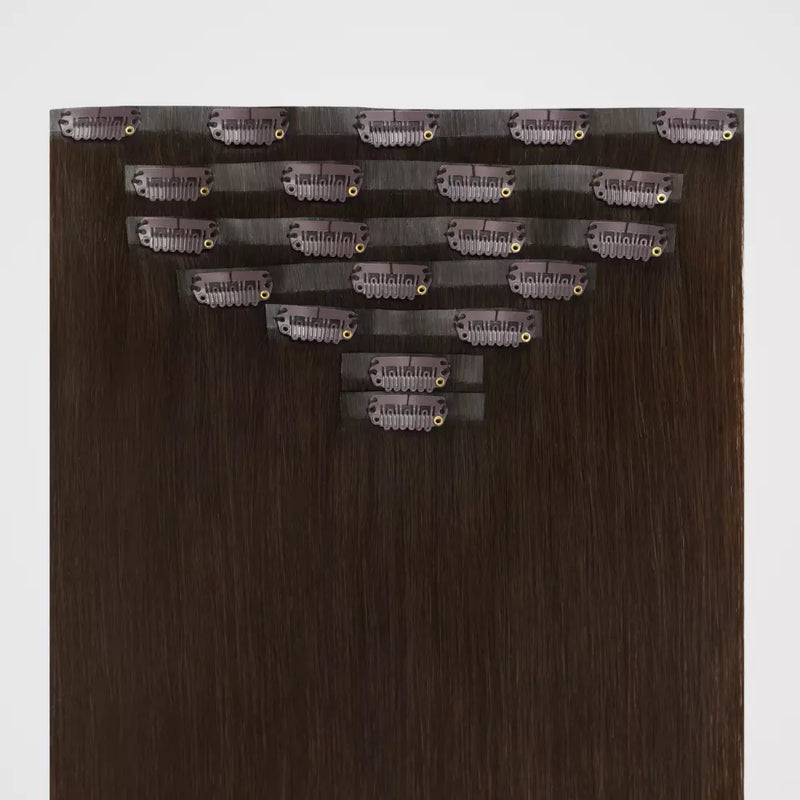 Load image into Gallery viewer, Brown remy clip in hair extensions on a white background
