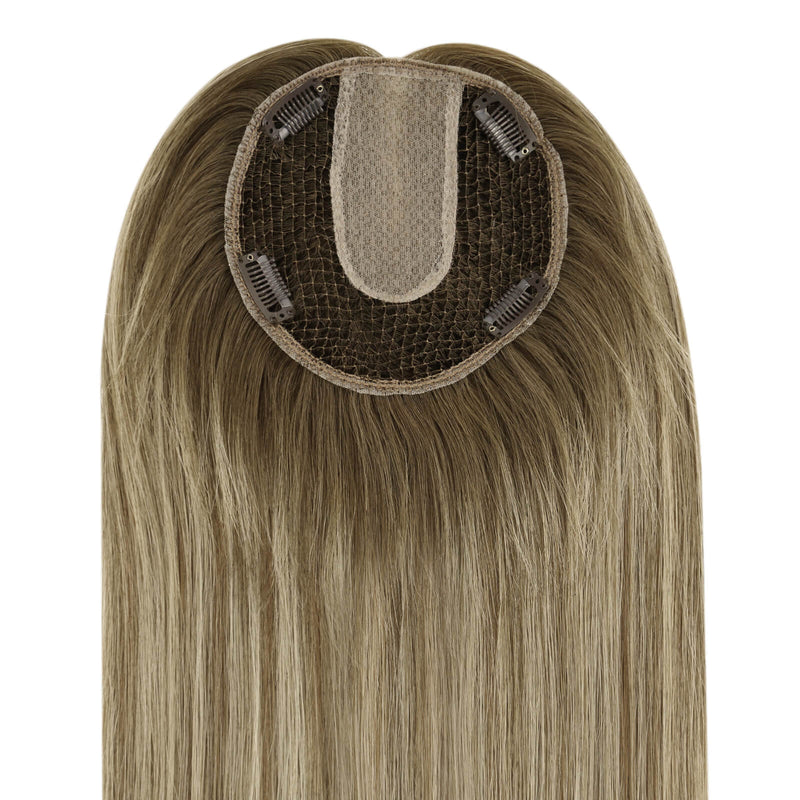Load image into Gallery viewer, A close-up of a straight hairpiece section, showing the beige adhesive base and dark mesh with clip-in springs, on a plain white background.

