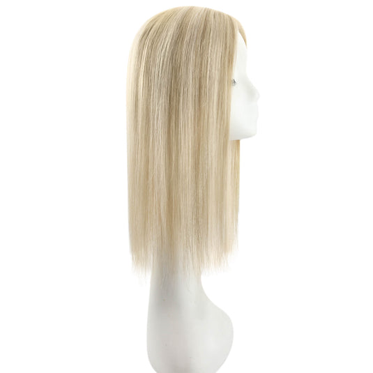 A straight, shoulder-length topper with a light ash blonde color, displayed on a white mannequin head against a plain white background.