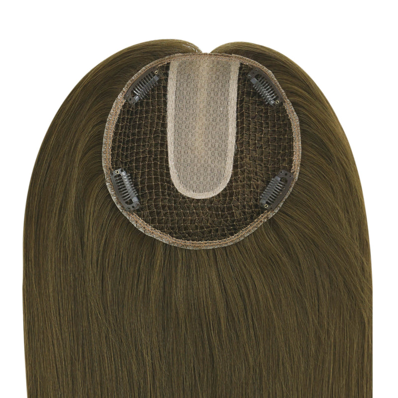 Load image into Gallery viewer, A close-up of a brown hairpiece extension showing the underside with a beige mesh center and four black clip-in clips, set against a plain white background.
