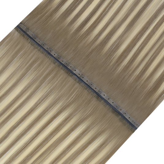 Close-up of blonde invisible flat weft hair extensions