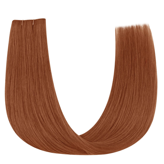 Copper red butterfly weft hair extension on a white background