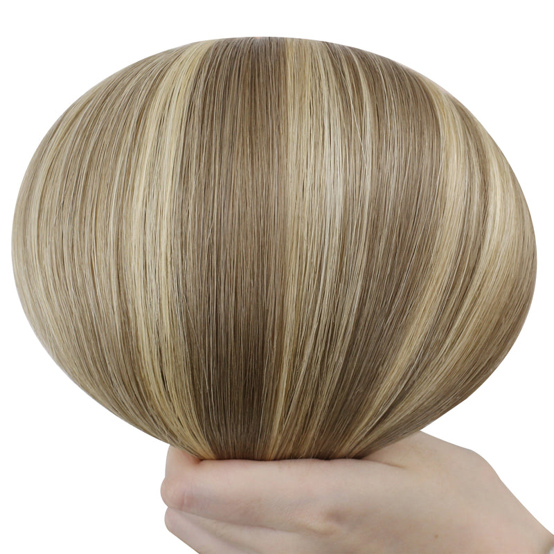 Load image into Gallery viewer, Hand holding a butterfly weft with brown and blonde color on a white background
