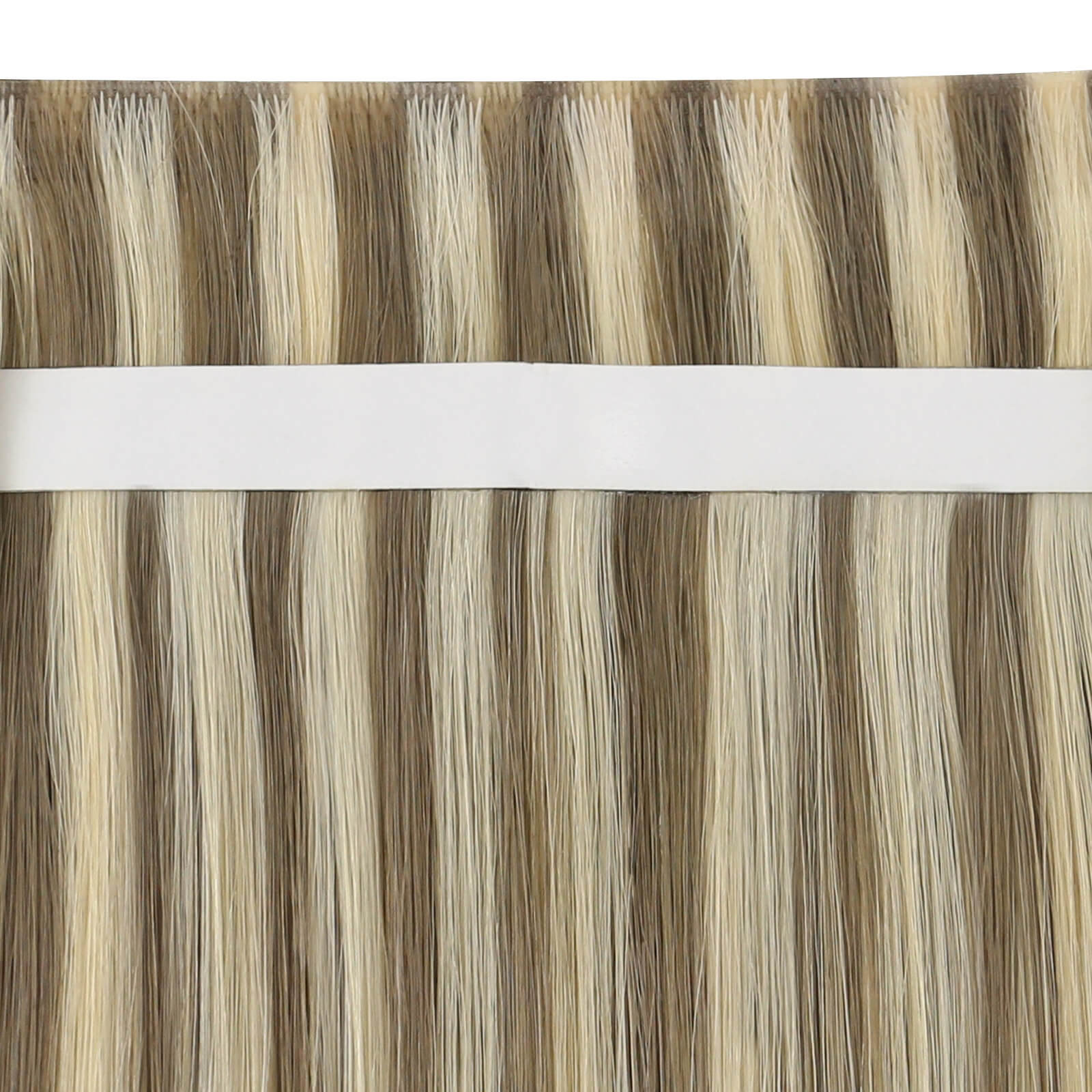 Close-up view of blonde highlight tape-in weft hair extensions.