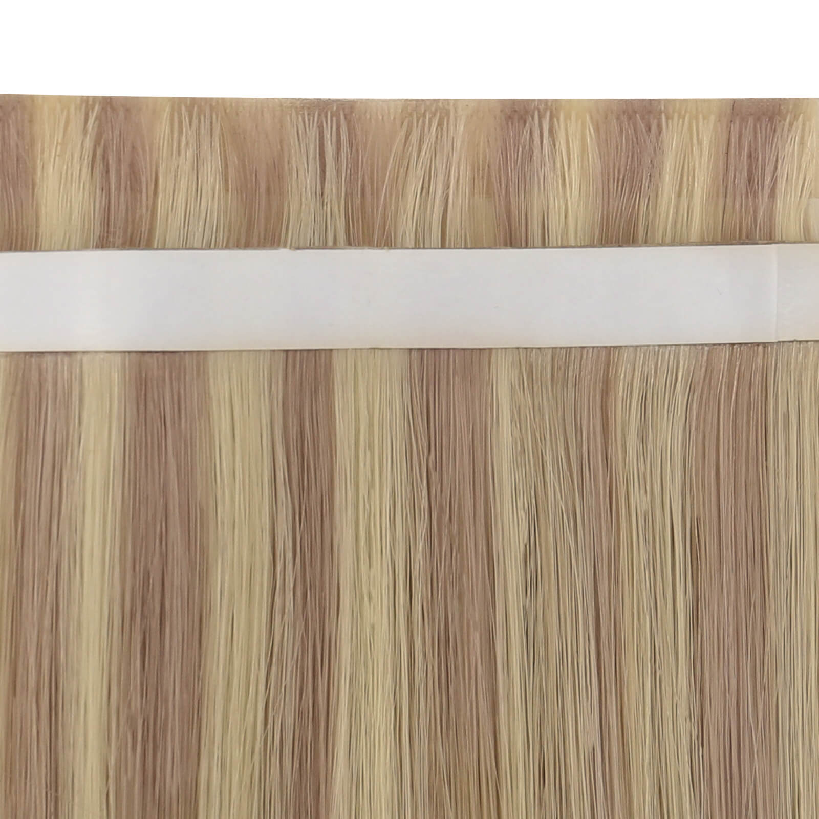 Close-up view of pink blonde highlight tape-in weft hair extensions.
