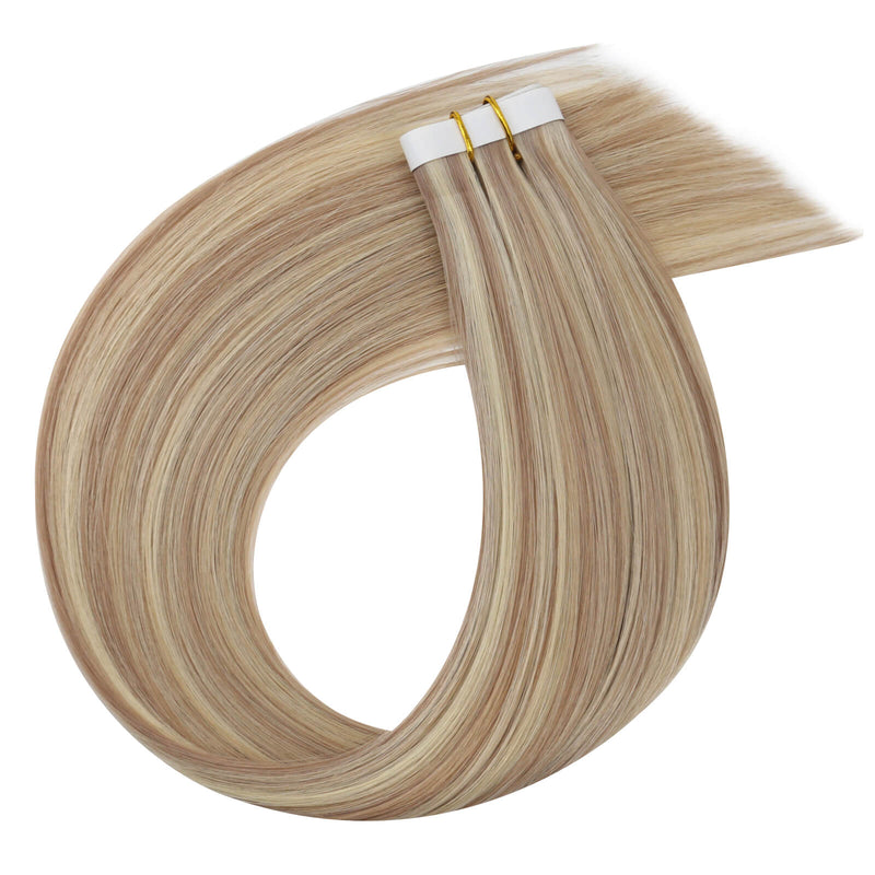 Load image into Gallery viewer, One bundle of straight invisible tape-in weft hair extensions featuring pink blonde highlights, secured with white bands and gold elastic ties, displayed on a white background.
