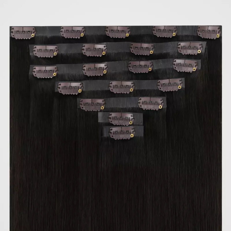 Load image into Gallery viewer, Brown remy clip in hair extensions on a white background
