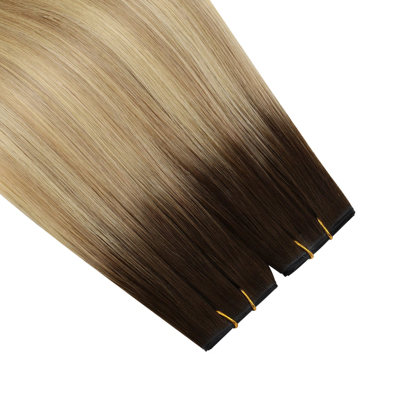 Load image into Gallery viewer, Two hair extensions with a gradient from blonde to brown on a white background

