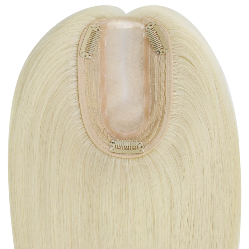 Load image into Gallery viewer, A close-up of a straight hairpiece section, showing the beige adhesive base and blonde mesh with clip-in springs, on a plain white background
