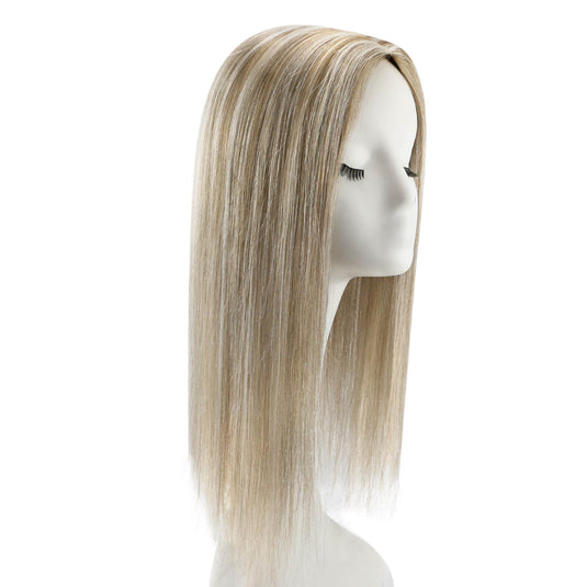 A long, straight topper with a blonde highlight color, displayed on a white mannequin head against a plain white background.