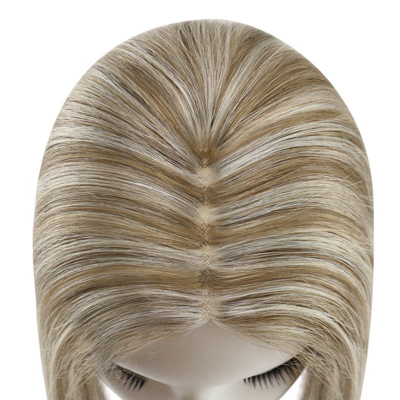 Load image into Gallery viewer, A close-up of a topper on a mannequin head, showing a center part with blended light brown and blonde streaks against a plain white background.
