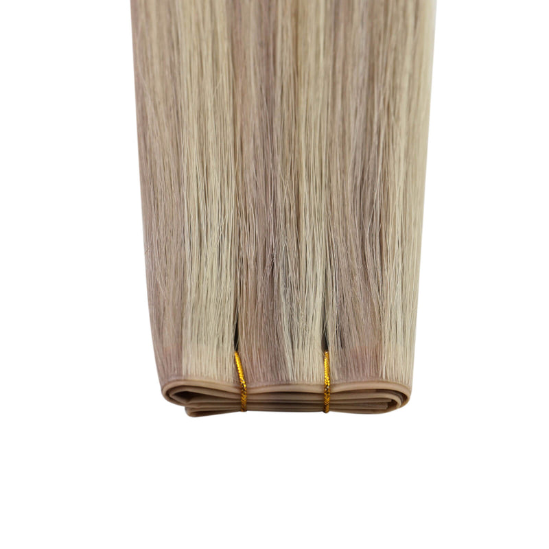 Load image into Gallery viewer, Close-up of invisible flat weft hair extensions
