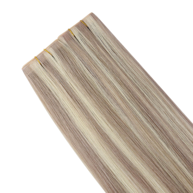 Load image into Gallery viewer, Four butterfly weft hair extension bundles with light ash blonde and beige highlights, shown against a solid white background.
