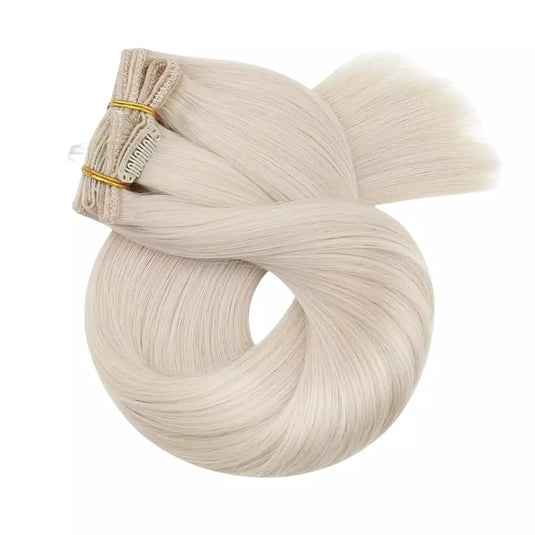 Blonde hair extensions on a white background