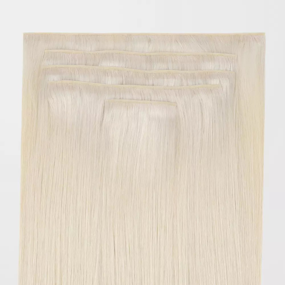 Set of Blonde genius clip in hair extensions on a white background