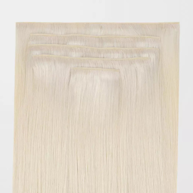 Load image into Gallery viewer, Set of Blonde genius clip in hair extensions on a white background
