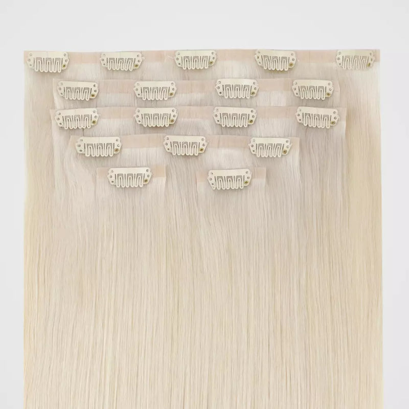Load image into Gallery viewer, Set of blonde invisible hair extensions with clips on a white background
