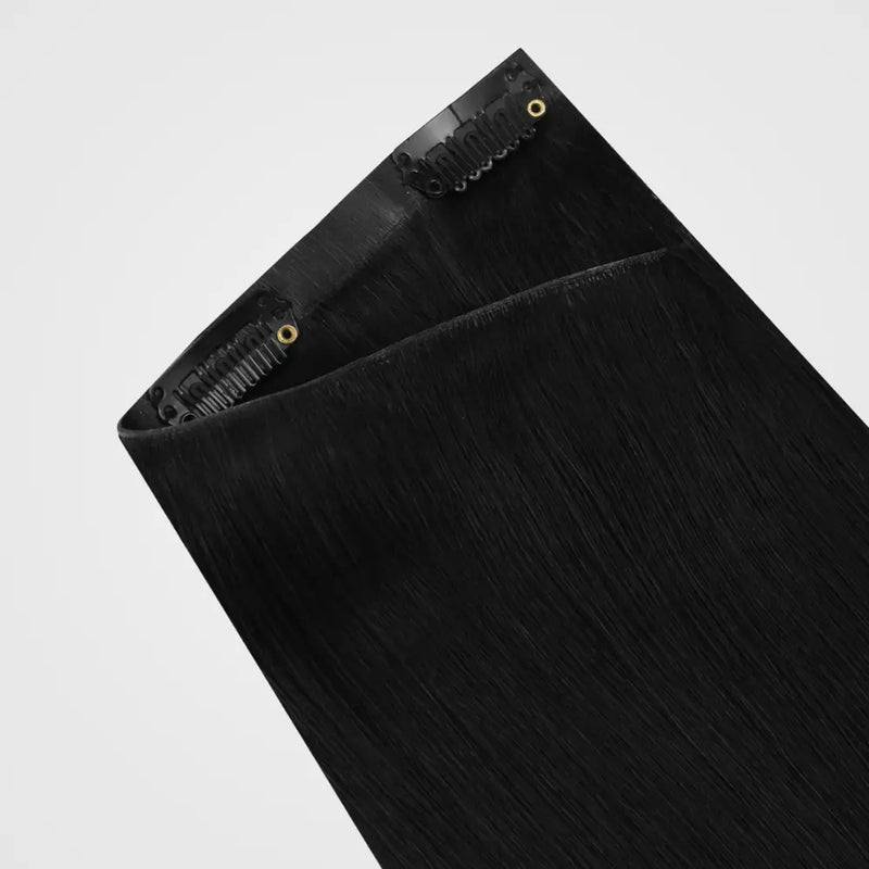 Load image into Gallery viewer, Black invisible clip hair extensions with black clips on a white background
