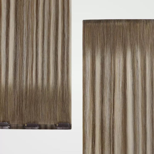 Set of clip hair extensions on a light gray background