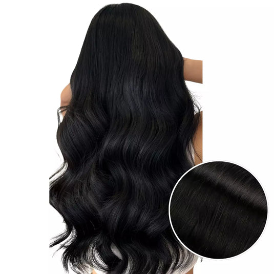 Model with long, jet black keratin hair extensions on a white background