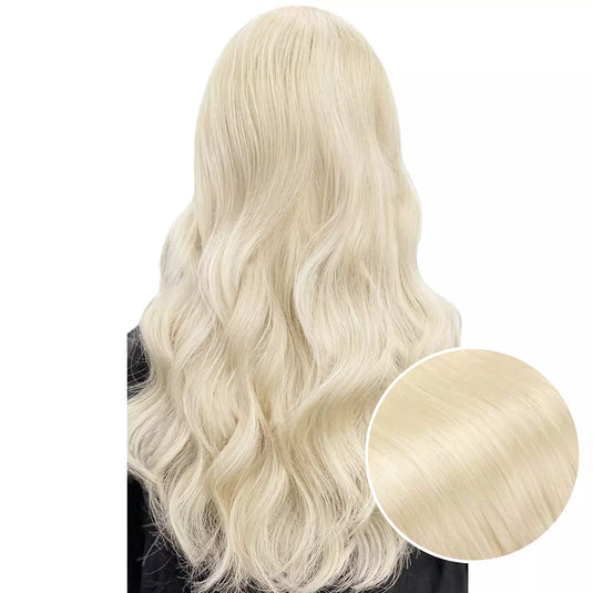 Model with long, light blonde tape hair extensions on a white background