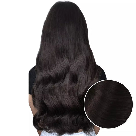 Model with long, dark brown tape hair extensions on a white background