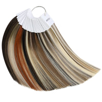 A set of human hair color samples displayed in a fan-like arrangement, with a variety of shades ranging from light blonde to dark brown.