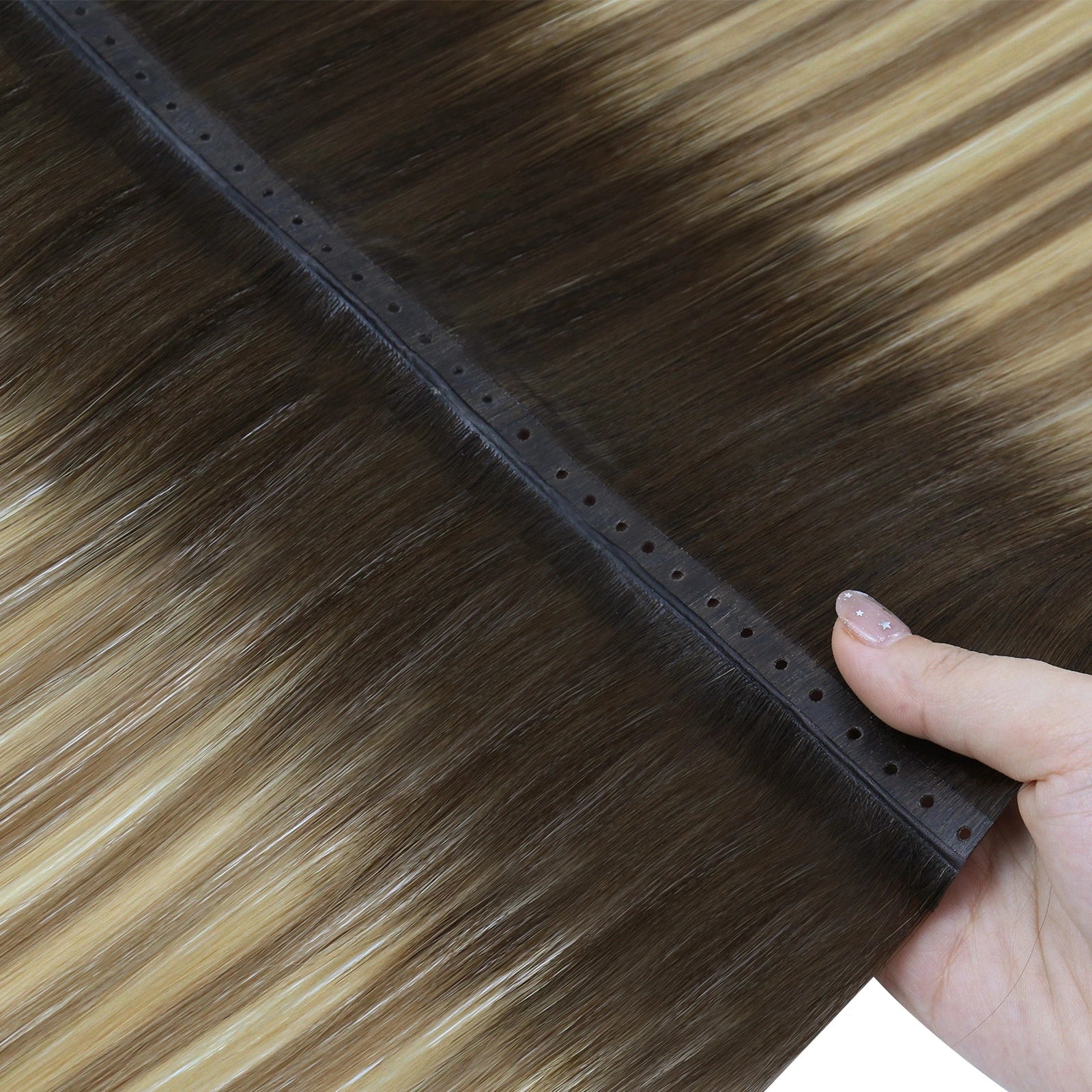 Hair extension with a hand holding the base, showing a close-up of the product.
