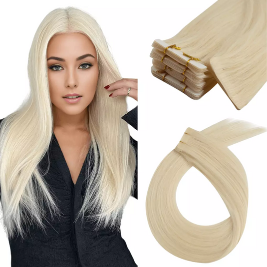 Woman with long blonde hair and hair extensions on a white background